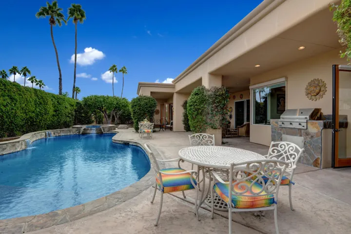 POOL SIDE DINING TO POOL AND HOUSE