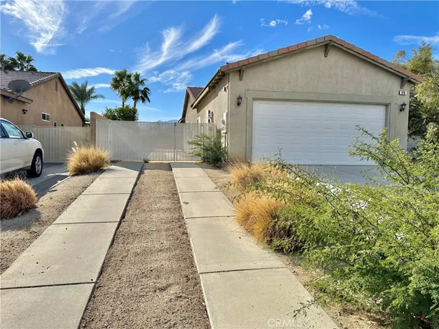 Extra long driveway and gated RV parking in the sideyard.