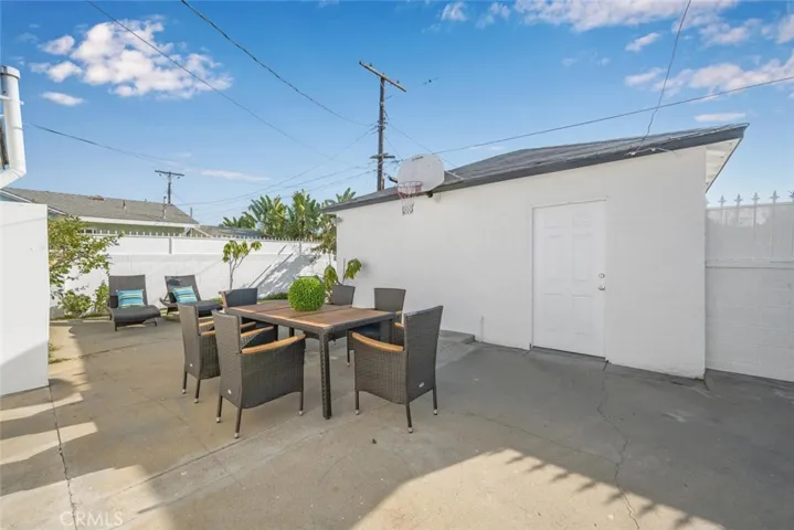 Detatched garage with pedestrian door access to the backyard patio area