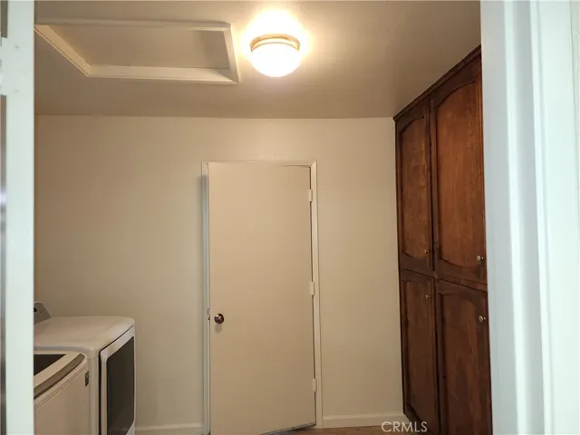 laundry room with lots of storage
