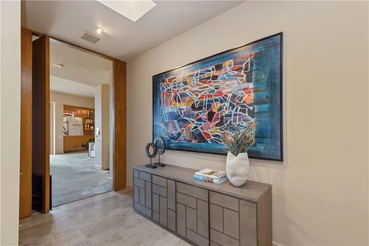 Foyer walking into Primary Bedroom Suite