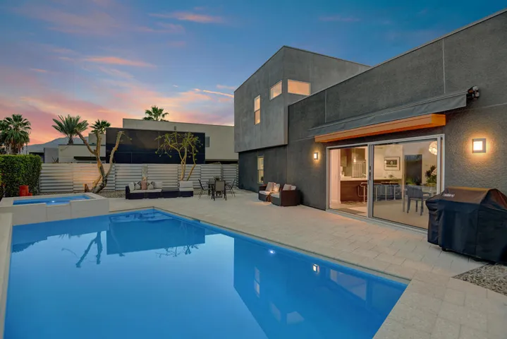 POOL AND SPA TO BACK OF HOUSE NIGHT MLS