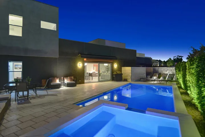 SPA AND POOL TO BACK OF HOUSE NIGHT MLS