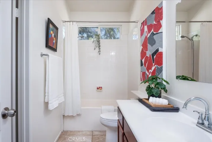 The guest bathroom with private entry to the larger guest bedroom.