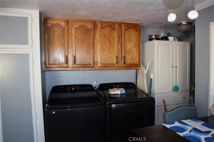 Front house washer and dryer area in by kitchen area