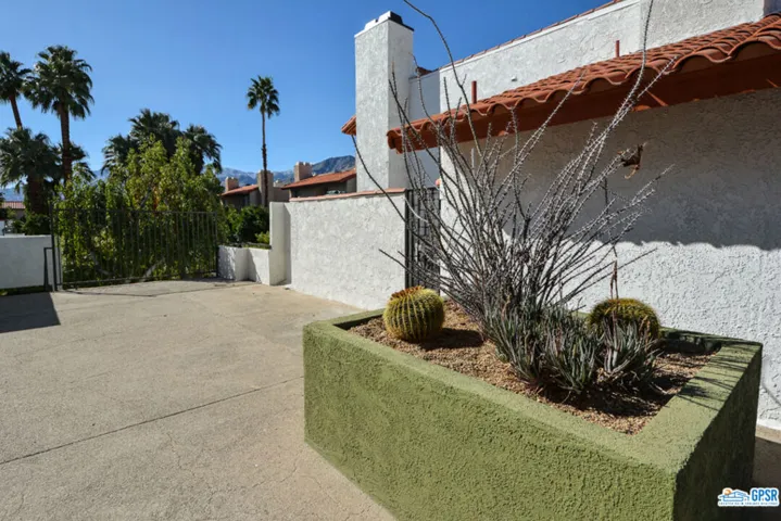Patio gate leads to Common Area Courtyard and Pools