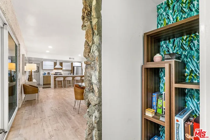Through the arch in the stone wall brings you to a hidden game room