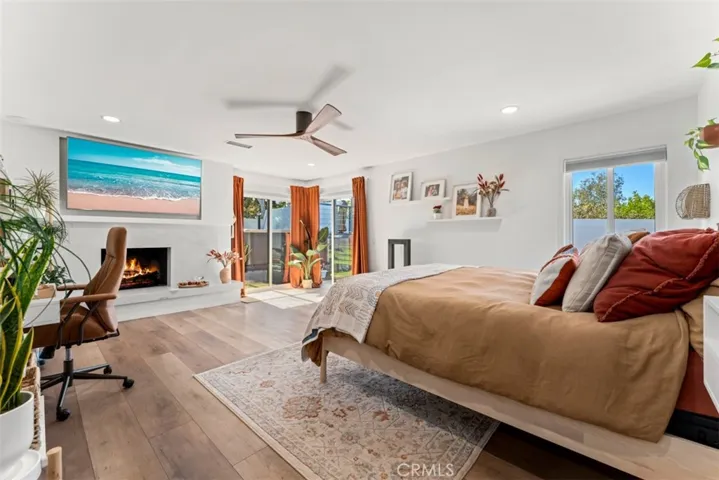 The master bedroom has a fireplace and a sliding door to the backyard.
