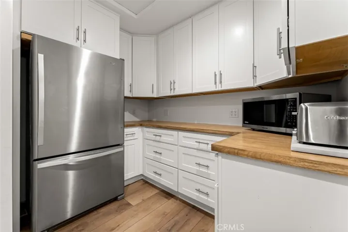 The butler's pantry is located just off the kitchen and features a second fridge and lots of pantry storage and counter space.