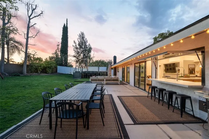 Check out the amazing kitchen window that fully opens to the backyard.