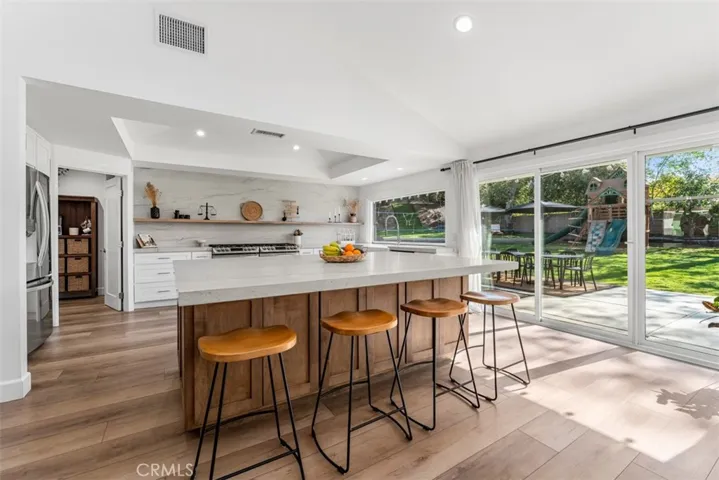 Breakfast bar seating at the huge kitchen island.
