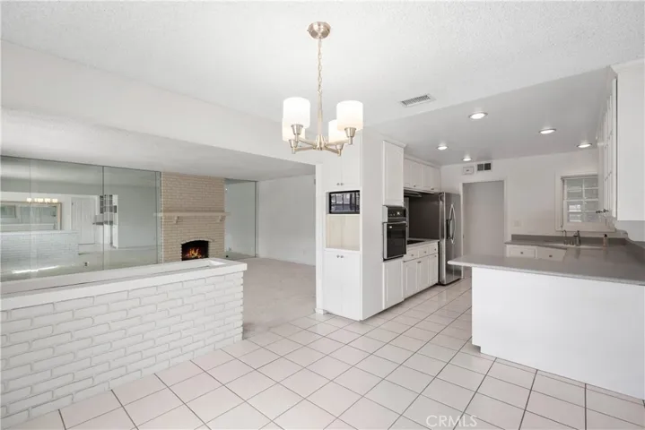 Dining Area, Living Room & Kitchen with Breakfast Bar not staged