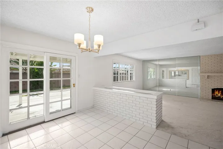 Dining area overlooking backyard and Living Room, not staged