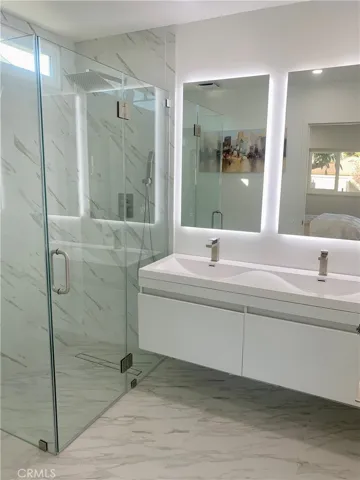 Backlit and heated mirrors in both baths
