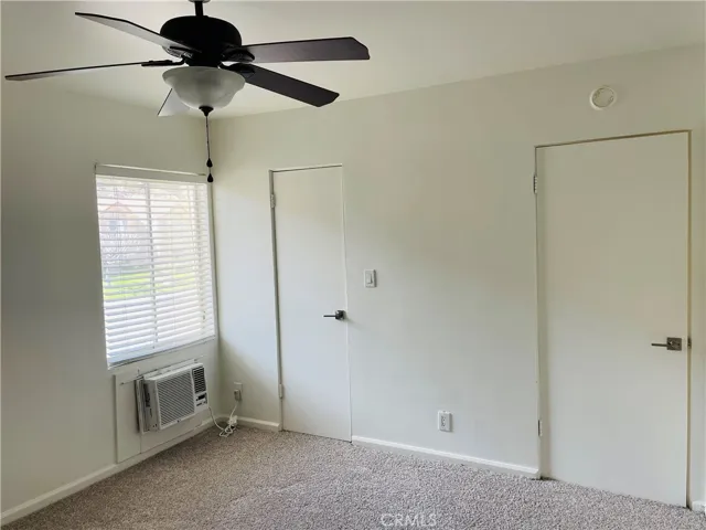 Bedroom looking toward window and closet