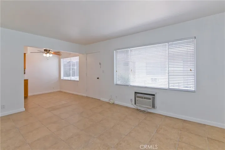 Living room toward entry and dining