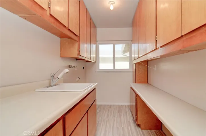 Storage...Storage...and MORE Storage in this convenient utility/mud room.  This is a crafter's paradise!