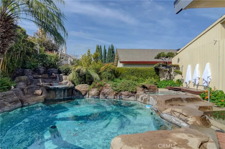 Resort style pool with waterfall and spa...this is a staycation paradise!