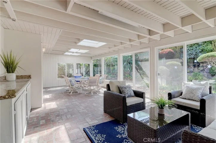 You will probably be spending a lot of time in this gorgeous sun room...soooo much natural light!