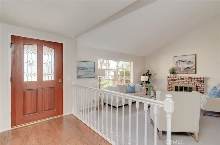 Leaded glass entry door and peg flooring add nice details to the foyer.