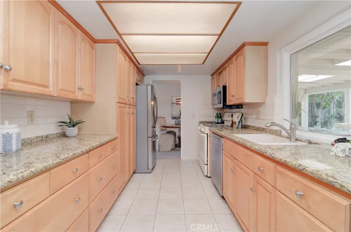 Check out all of the cabinet and counter space!  Plenty of room for "helpers" here... Love those big pot and pan drawers!