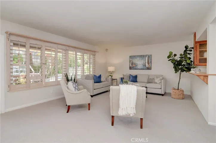 This is a HUGE family area...custom wood shutters add a designer touch.