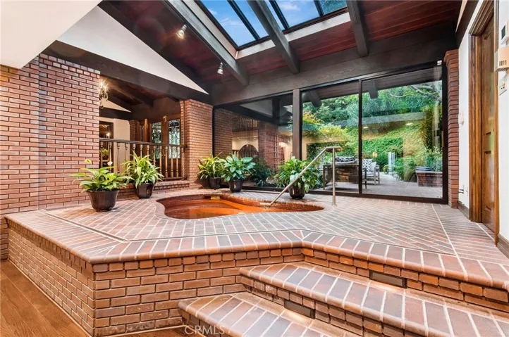 Indoor spa with close access to one of the primary bathrooms