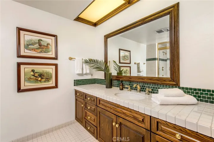 Guest bathroom down the hallway leading to Game Room