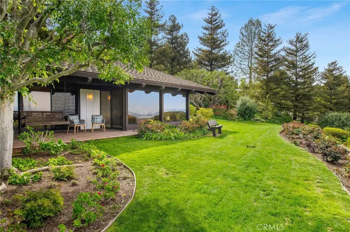 View of the lush & grassy side yard