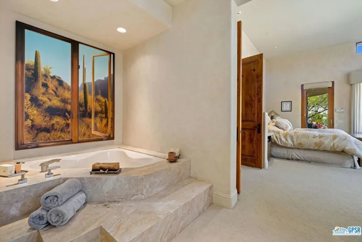 Primary Bathroom with raised spa tub