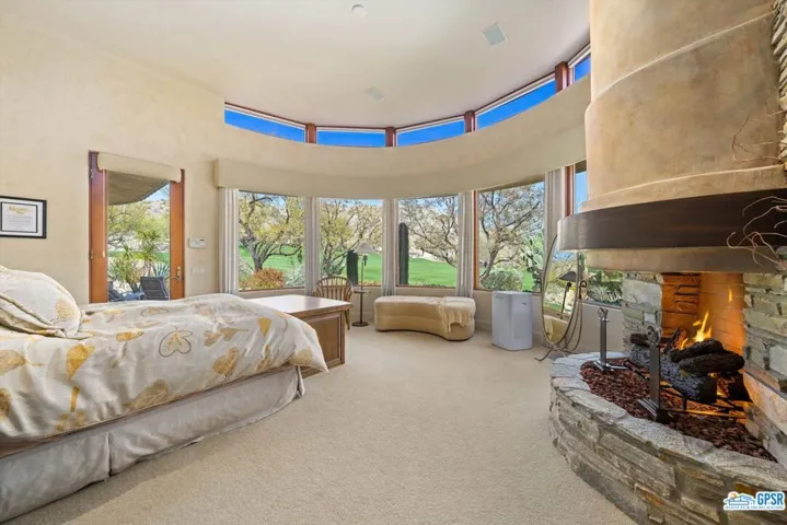Primary Bedroom with fireplace and clerestory windows