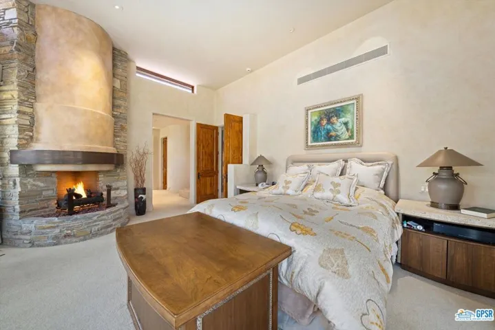 Primary Bedroom with fireplace reversed view