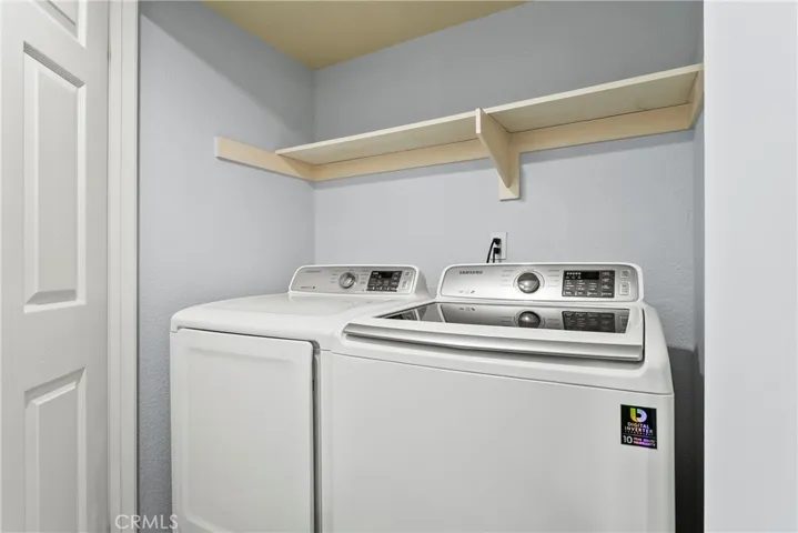 Washer and dryer are located in their own closet inside the unit.