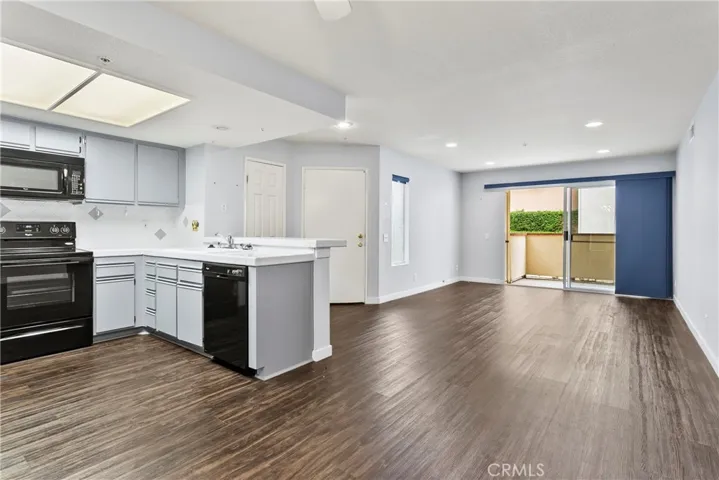 plenty of natural light, new vinyl plank flooring, paint, and recessed lighting.
