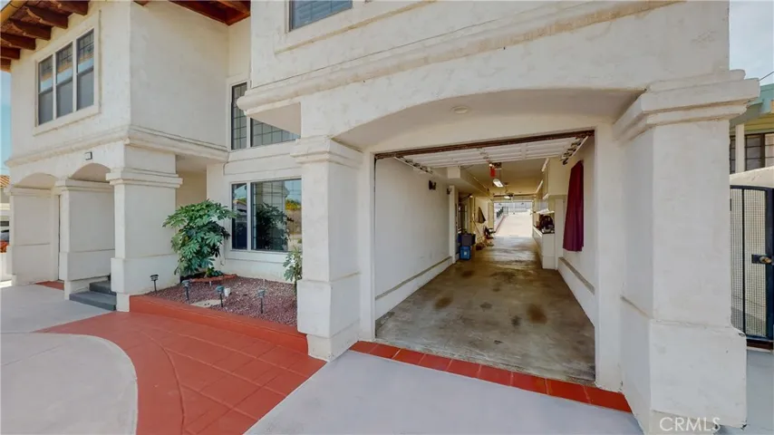 This drive through garage gives access for the rear ADU as well as the bonus 3rd building