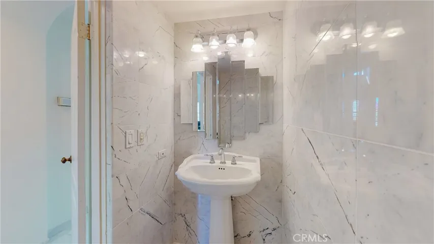 Your guests will find a beautiful powder room on the first level