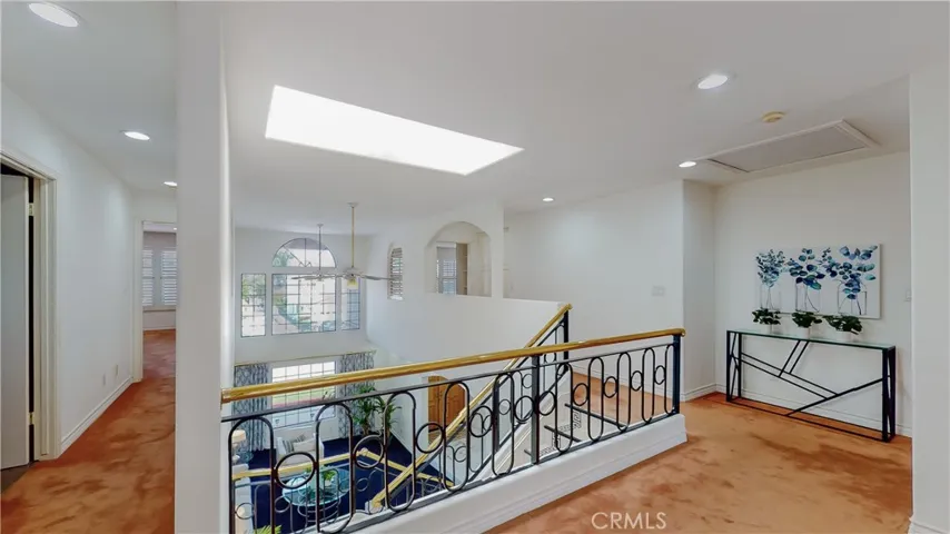 Reach the second level and find 4 bedrooms and 3 baths