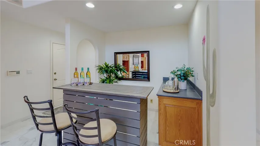 Room for your custom bar along with the permanent wet bar and cabinet