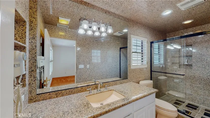 2 bedrooms share this richly finished bathroom