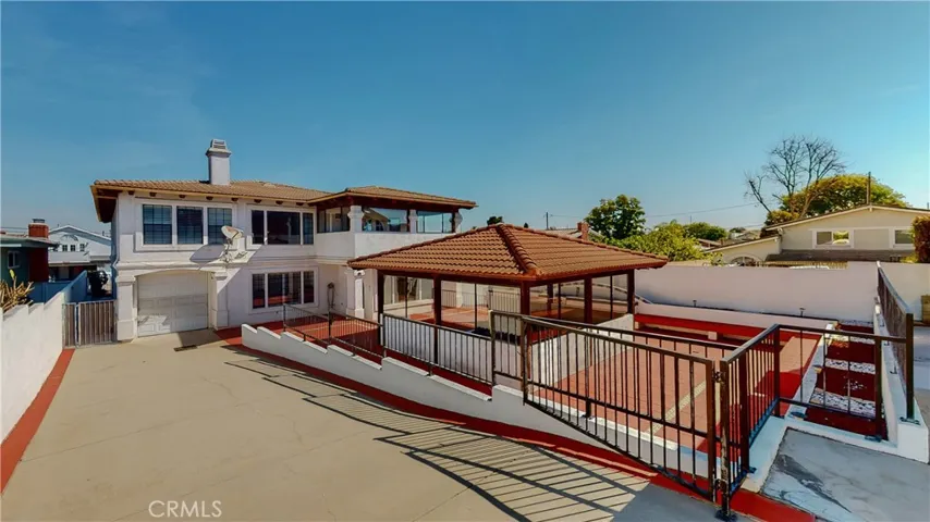 The gazebo area has an abundance of seating both inside and outside of it
