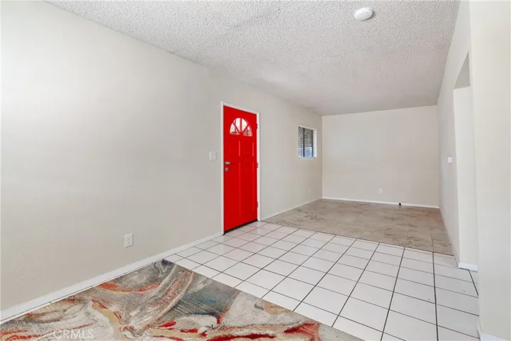 Front Door and View of Living Room from the Dining Area