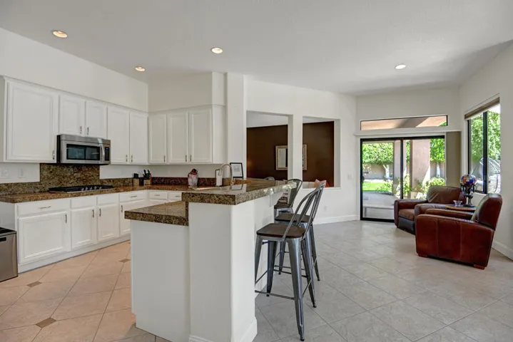 ACROSS BREAKFAST BAR TO KITCHEN MLS