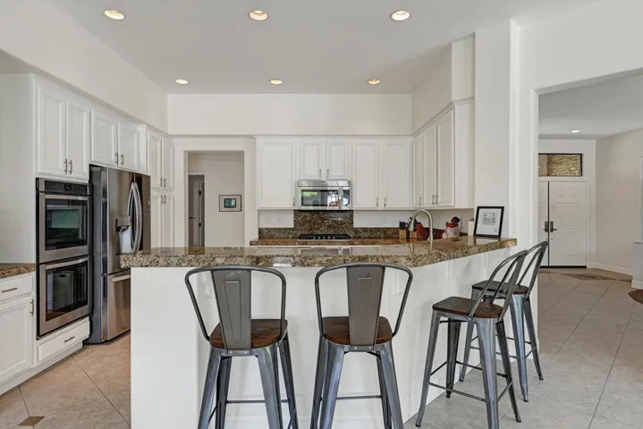 KITCHEN TO ENTRY OVER BREAKFAST BAR MLS