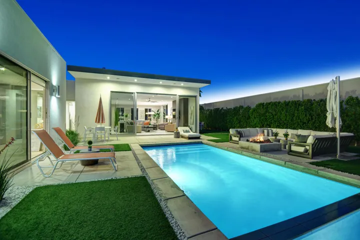 SPA AND POOL TO FIRE PIT AND HOUSE NIGHT