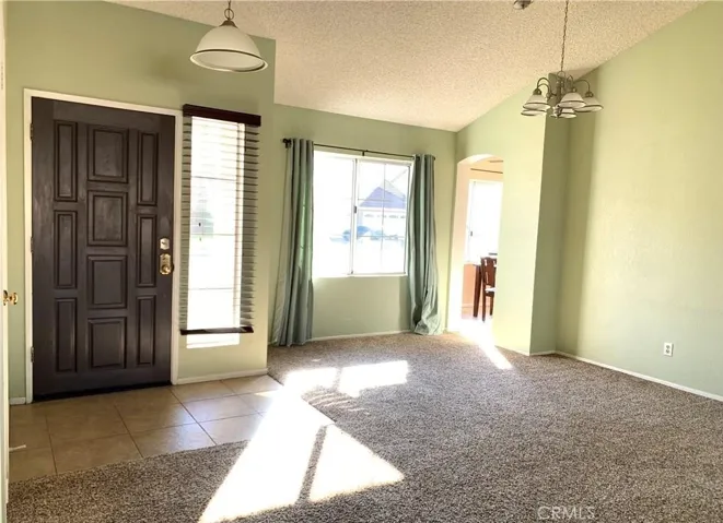 With no furniture's, entry and dinning area leading to kitchen.