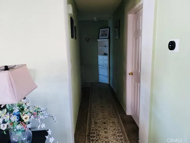 Hallway leads to Laundry room and Bonus room. Also leads to garage.
