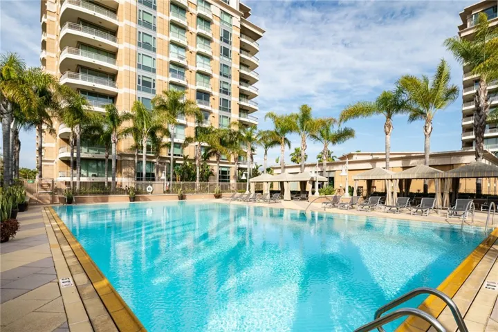 community pool with gazebos