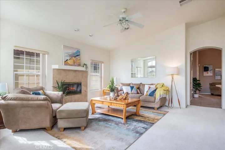 The light and  bright living room with fireplace.