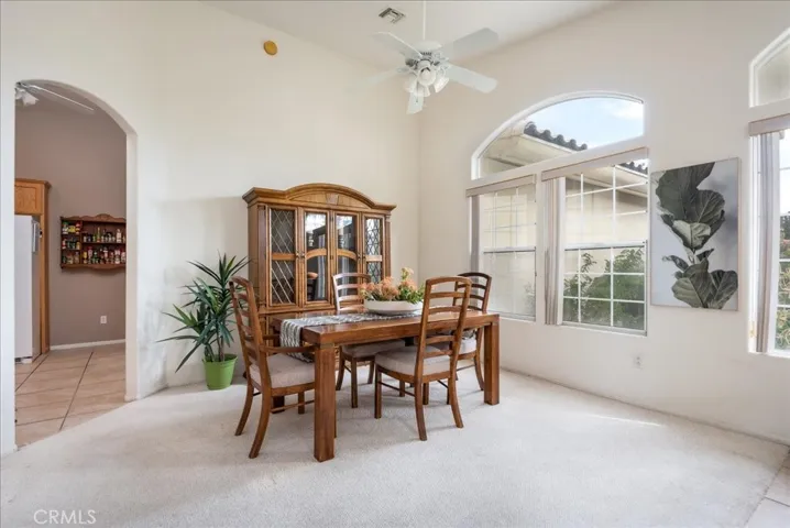 The dining area looks out to the front garden and courtyard.