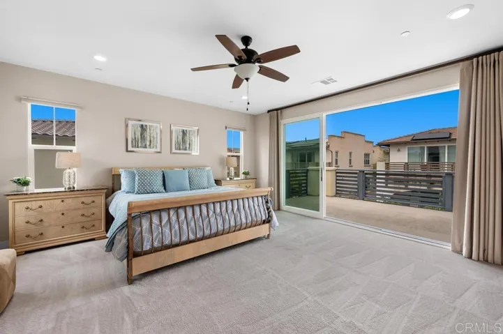 Large Primary Bedroom with Sliding Glass Doors open to Balcony (& Custom Curtains)